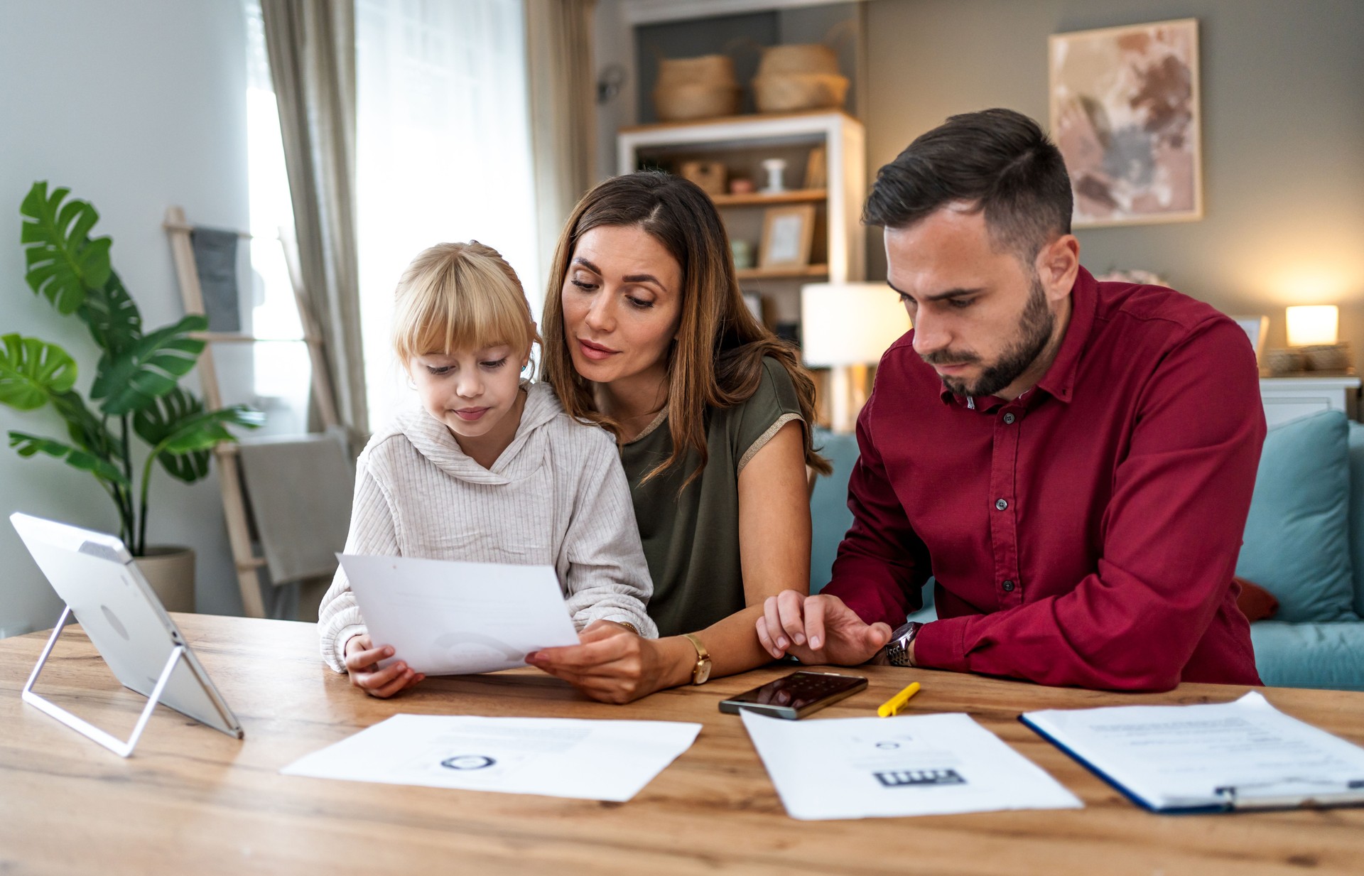 Young family managing a budget and paying bills and taxes